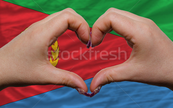 over flag of eritrea showed heart and love gesture made by hands Stock photo © vepar5