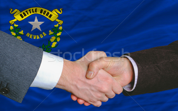 in front of american state flag of nevada two businessmen handsh Stock photo © vepar5