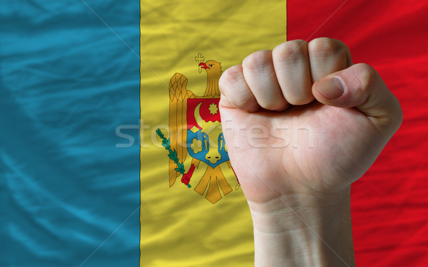 Hard fist in front of moldova flag symbolizing power Stock photo © vepar5