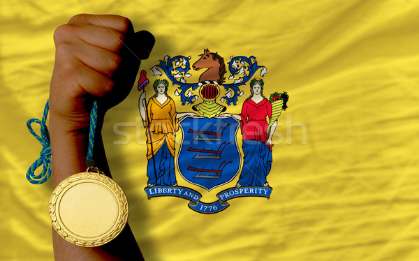 Gold medal for sport and  flag of american state of new jersey   Stock photo © vepar5