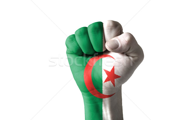 Stock photo: Fist painted in colors of algeria flag