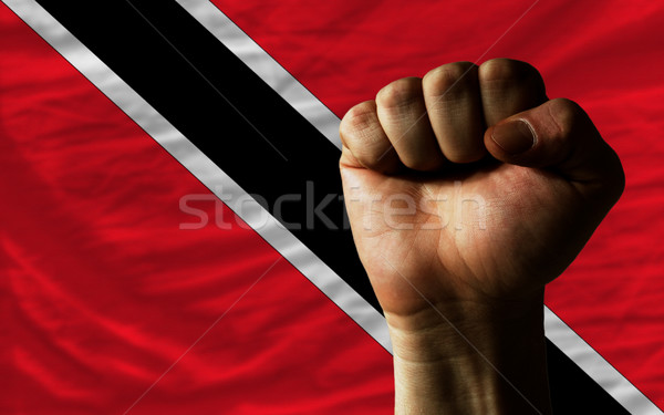 Hard fist in front of trinidad tobago flag symbolizing power Stock photo © vepar5