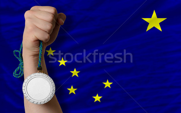 Silver medal for sport and  flag of american state of alaska    Stock photo © vepar5