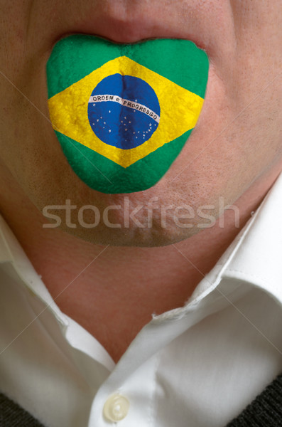 man tongue painted in brazil flag symbolizing to knowledge to sp Stock photo © vepar5