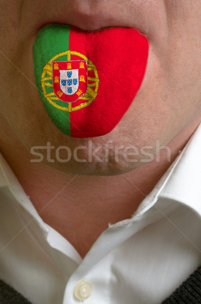 man tongue painted in portugal flag symbolizing to knowledge to  Stock photo © vepar5