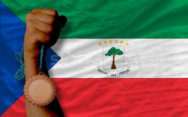 Bronze medal for sport and  national flag of  of equatorial guin Stock photo © vepar5
