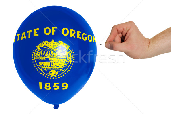 Bursting balloon colored in  flag of american state of oregon    Stock photo © vepar5