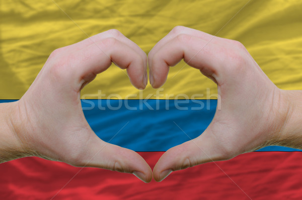 Heart and love gesture showed by hands over flag of columbia bac Stock photo © vepar5