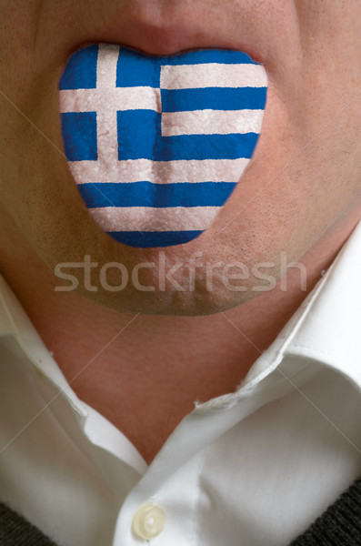 man tongue painted in greece flag symbolizing to knowledge to sp Stock photo © vepar5