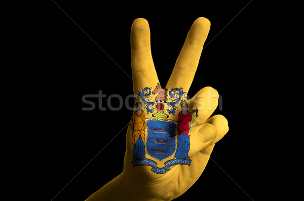new jersey us state flag two finger up gesture for victory and w Stock photo © vepar5