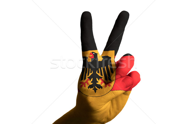 Stock photo: germany national flag two finger up gesture for victory and winn
