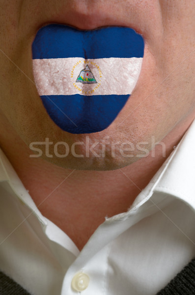 man tongue painted in nicaragua flag symbolizing to knowledge to Stock photo © vepar5