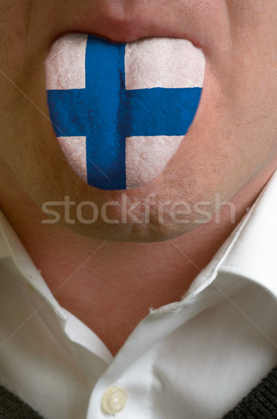 man tongue painted in finland flag symbolizing to knowledge to s Stock photo © vepar5