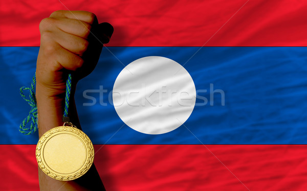 Aranyérem sport zászló Laosz nyertes tart Stock fotó © vepar5