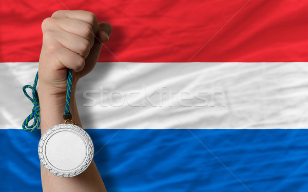 Silver medal for sport and  national flag of holland    Stock photo © vepar5