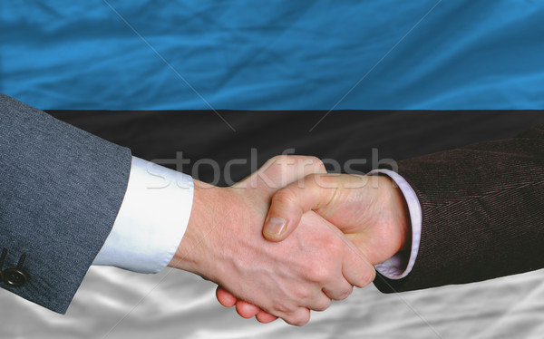 businessmen handshake after good deal in front of estonia flag Stock photo © vepar5