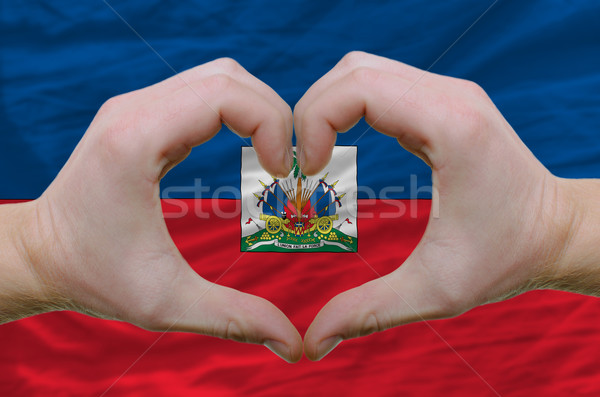 Heart and love gesture showed by hands over flag of haiti backgr Stock photo © vepar5