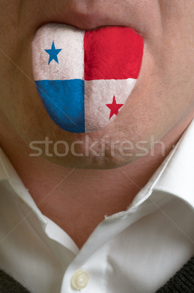 man tongue painted in panama flag symbolizing to knowledge to sp Stock photo © vepar5