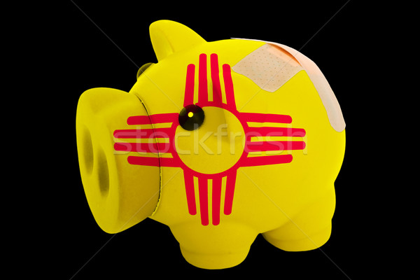 bankrupt piggy rich bank in colors of flag of american state of  Stock photo © vepar5