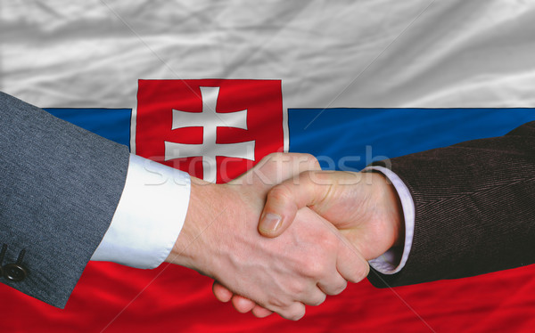 Empresarios apretón de manos buena acuerdo Eslovaquia bandera Foto stock © vepar5