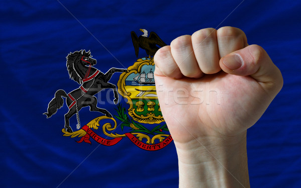 us state flag of pennsylvania with hard fist in front of it symb Stock photo © vepar5