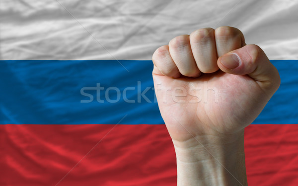 Hard fist in front of russia flag symbolizing power Stock photo © vepar5