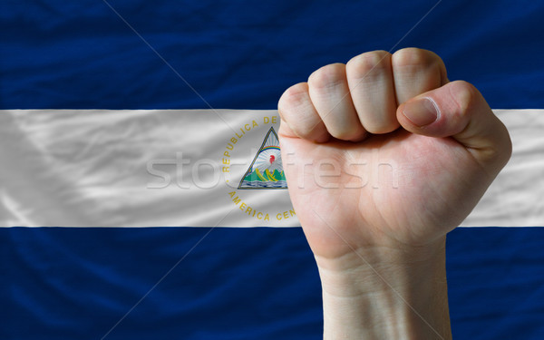 Hard fist in front of nicaragua flag symbolizing power Stock photo © vepar5