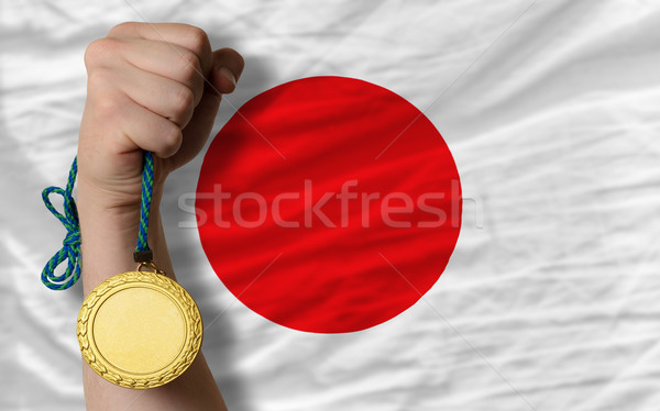 Stock photo: Gold medal for sport and  national flag of japan   