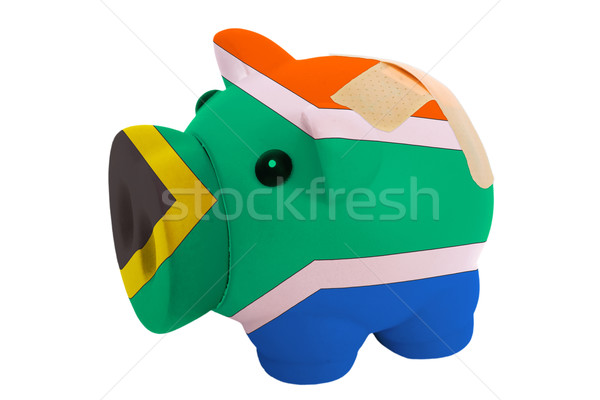 closed piggy rich bank with bandage in colors national flag of s Stock photo © vepar5