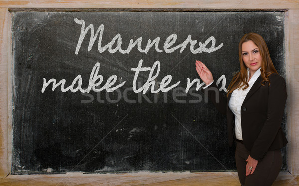Teacher showing Manners make the man on blackboard Stock photo © vepar5