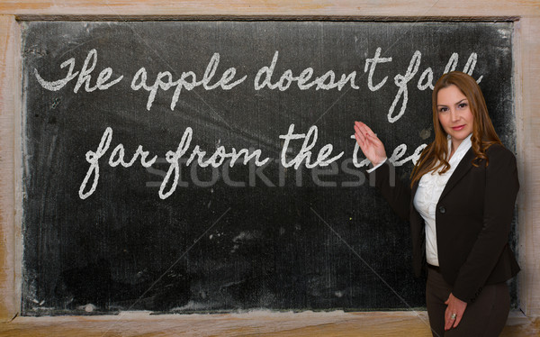 Teacher showing The apple doesn t fall far from the tree on blac Stock photo © vepar5