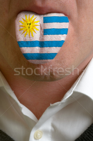 man tongue painted in uruguay flag symbolizing to knowledge to s Stock photo © vepar5
