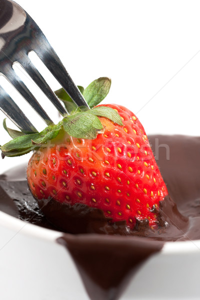 Strawberry Being Dipped In Chocolate Stock photo © veralub