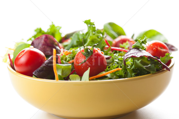 Bowl of fresh green salad with tomatoes Stock photo © veralub