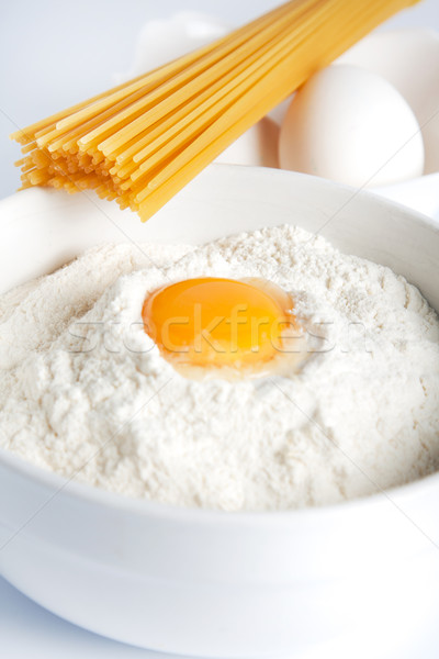 Egg yolk in a bowl of flour Stock photo © veralub