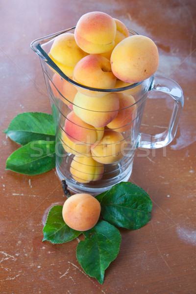 Ripe fresh apricots in jar Stock photo © veralub