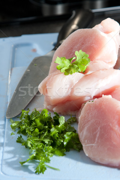 Lean chicken pieces with chopped parsley Stock photo © veralub