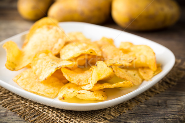 Hearty potato chips served on a plate Stock photo © vertmedia