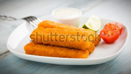 Fish fingers and potato salad Stock photo © vertmedia