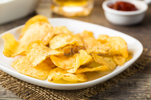 Stock photo: Hearty potato chips served on a plate