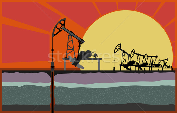 Oil pump machins against sunset. Stock photo © Vertyr