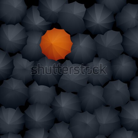 Top view of many black umbrellas, one orange. Stock photo © Vertyr