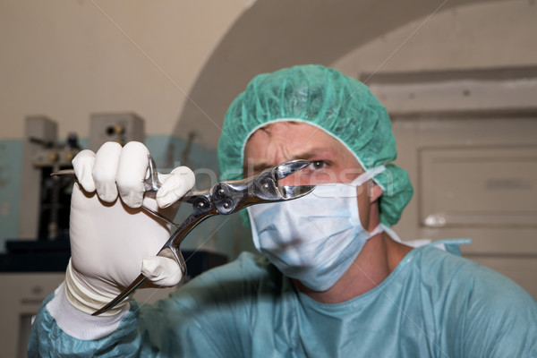 Surgeon show strange tool before coming surgery Stock photo © vetdoctor