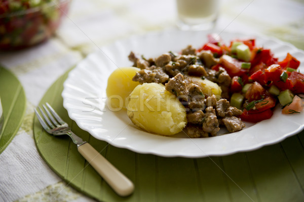 Baked potatoe with cooked meat and fresh salat Stock photo © vetdoctor