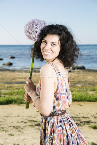 Woman with dark hairs hold lilac flower Stock photo © vetdoctor