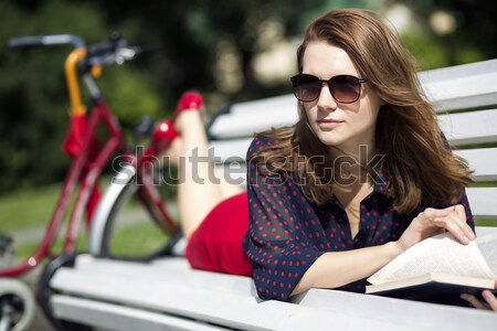 Woman lying on bench and read book Stock photo © vetdoctor