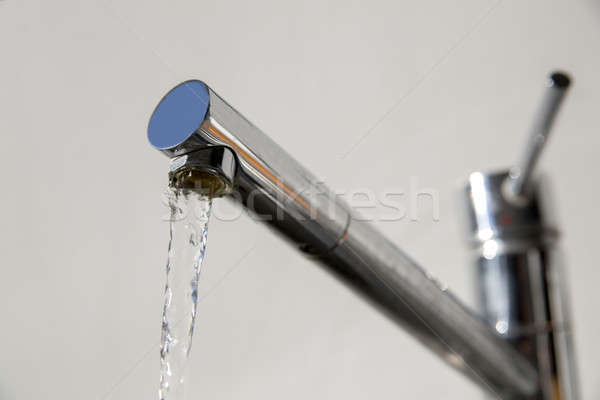 Faucet is opened and release warm water Stock photo © vetdoctor