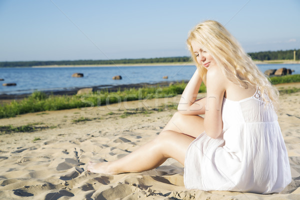 Woman in white dress indulgence on beach Stock photo © vetdoctor