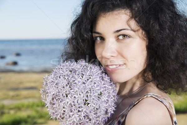 Young woman with dark hairs with flower Stock photo © vetdoctor