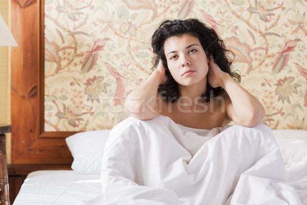 Woman adjust hairs in bed after night Stock photo © vetdoctor